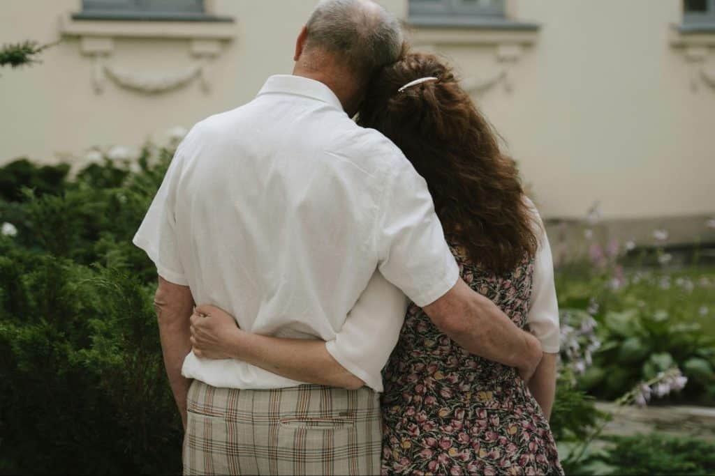 A man and woman embracing each other