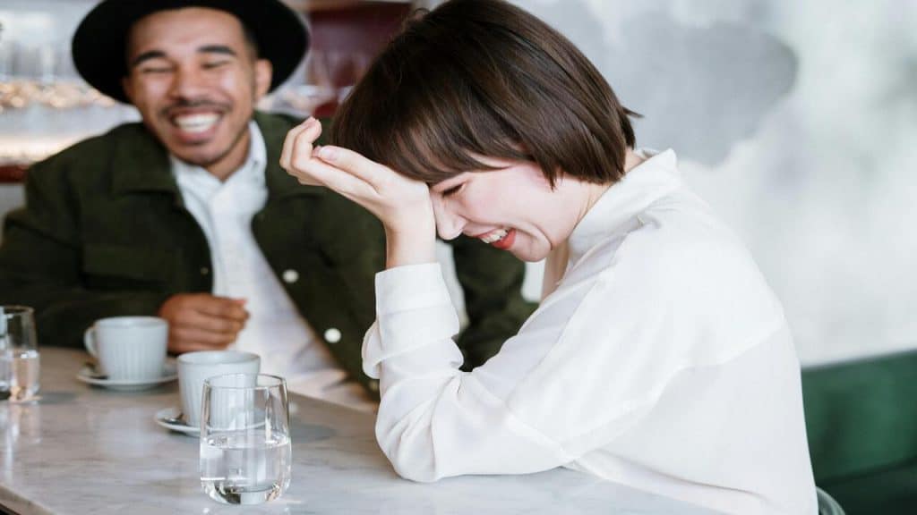 A couple laughing during their date