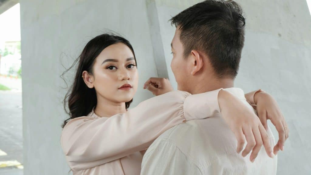 A man and a woman standing next to each other.