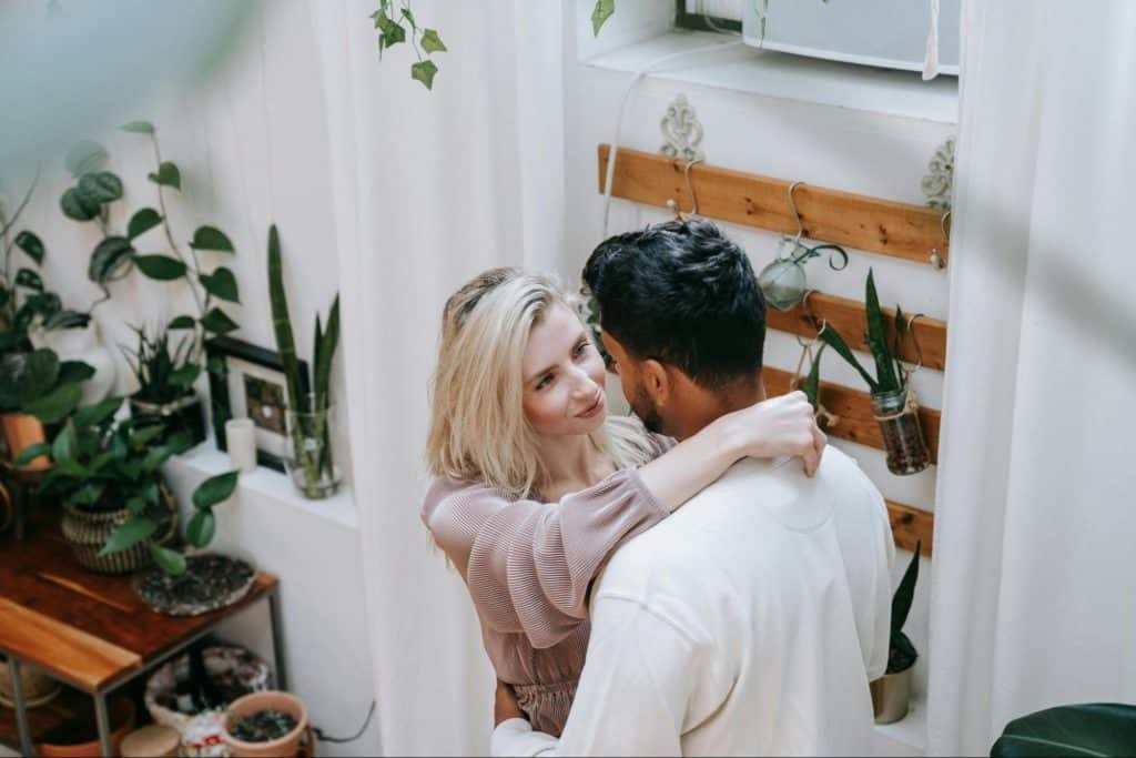 A woman hugging a man