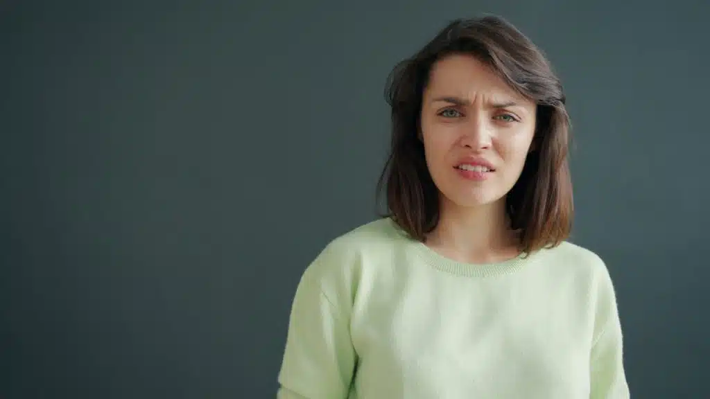 A woman who looks upset.