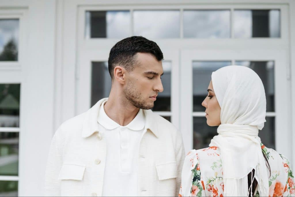 A man and woman facing each other