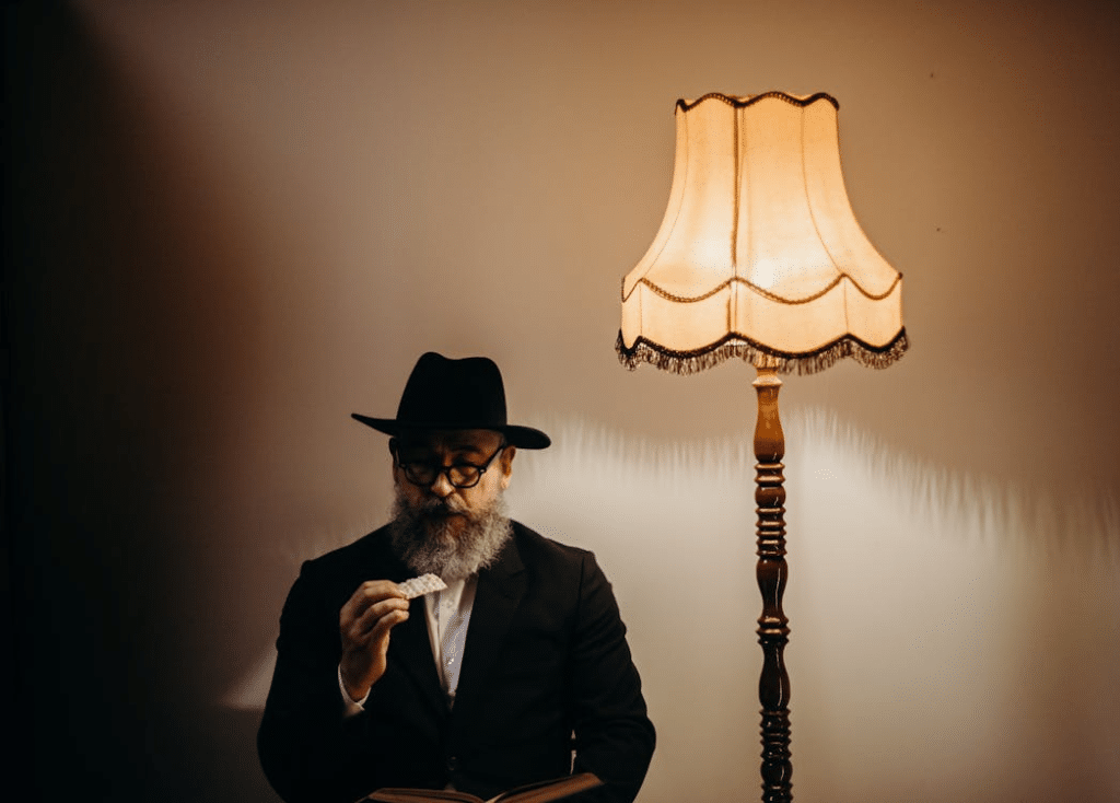 Man With a Hat Next to a Lamp
