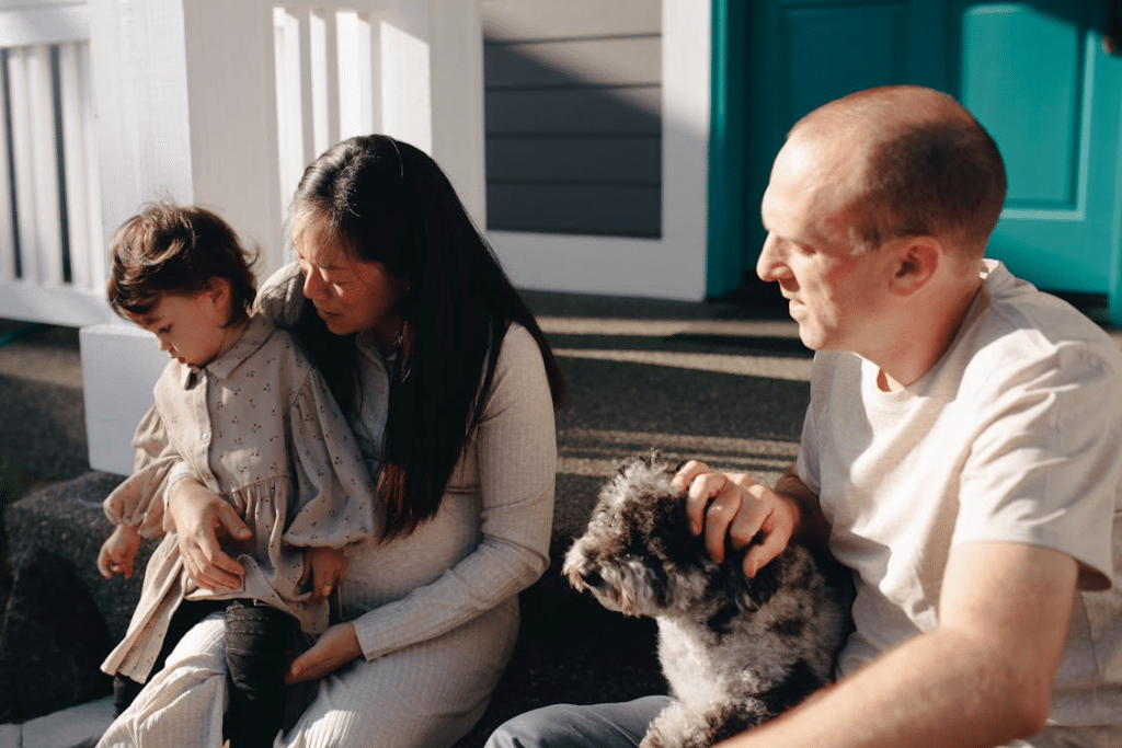 A family sitting on a step
