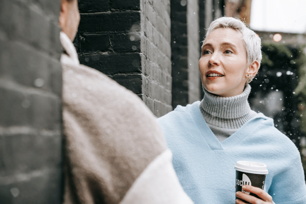 A woman holding a coffee