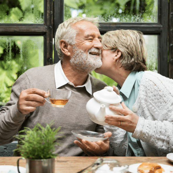 A couple having tea at home together