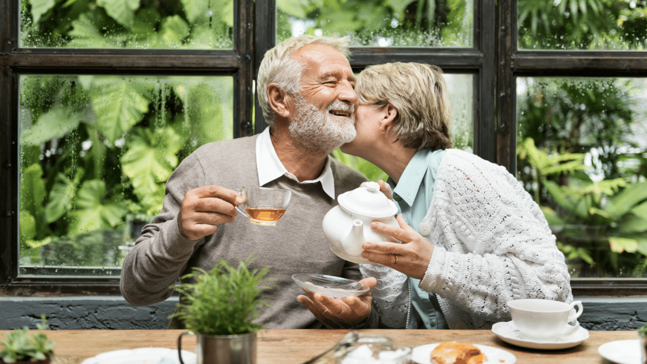 A couple having tea at home together