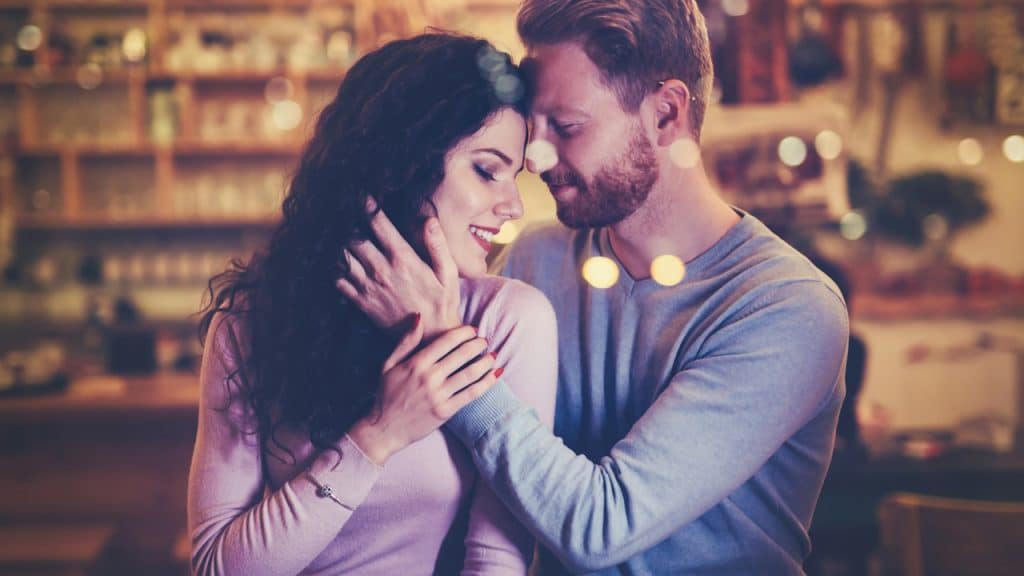 A beautiful couple dating in a cafe.