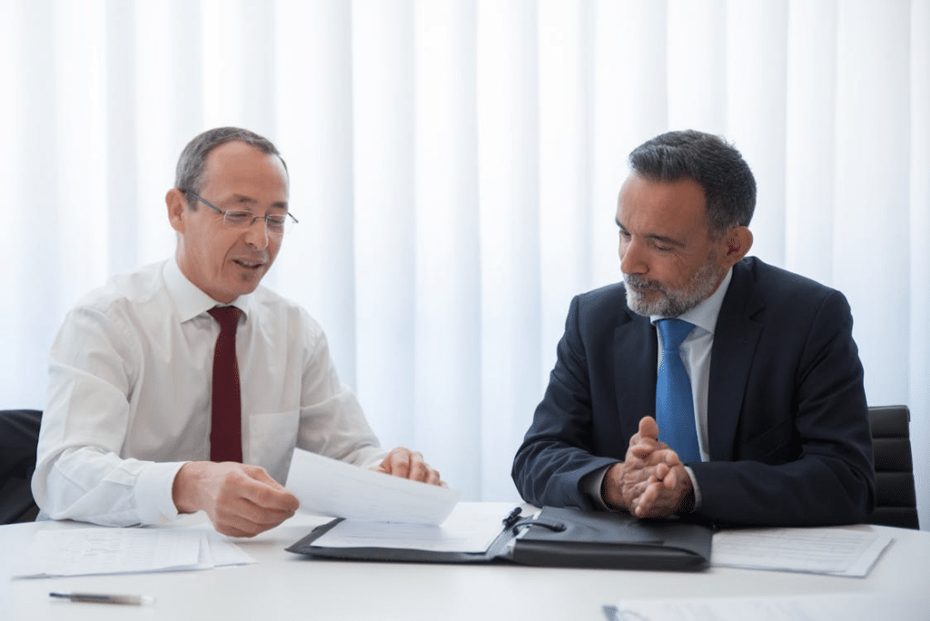 Two men in formal clothes talking