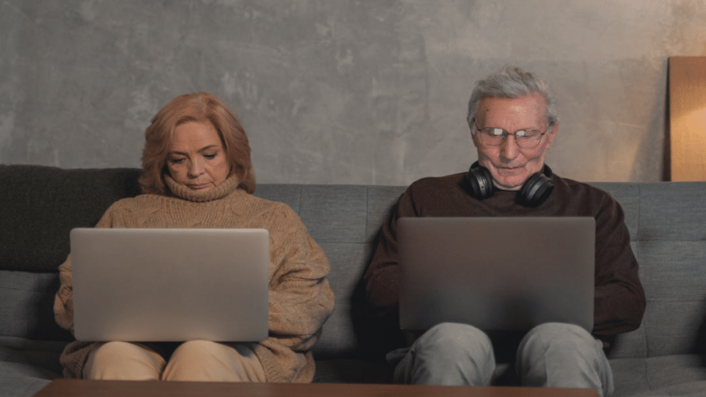A couple busy with their laptops