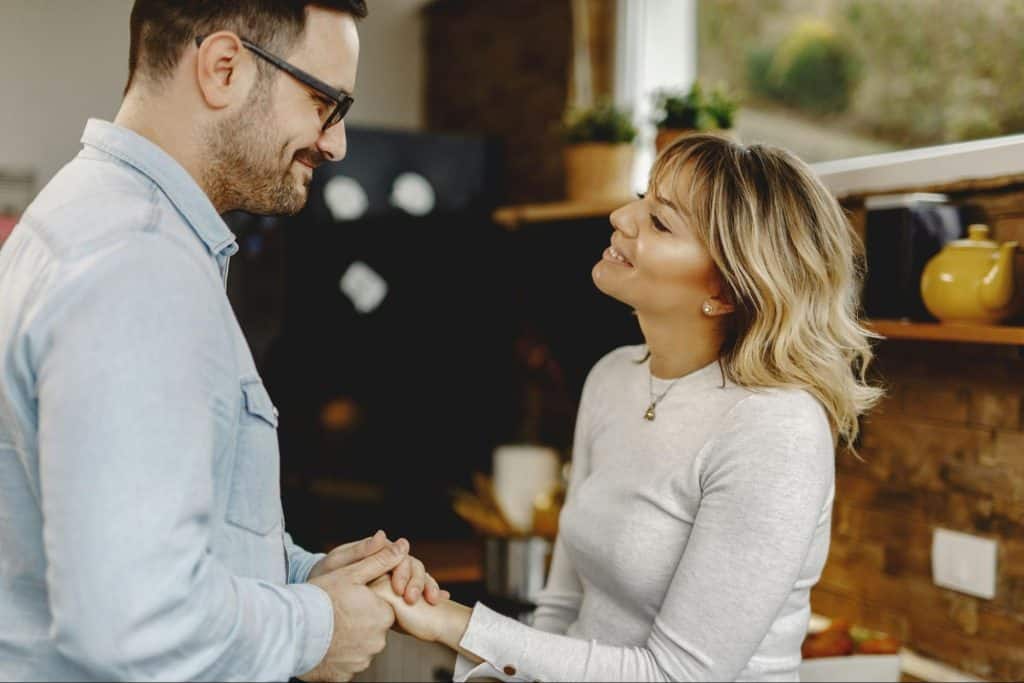 A man and woman holding hands