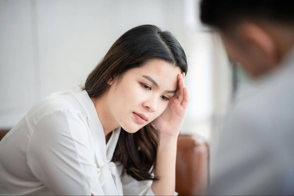 A woman talking to a man