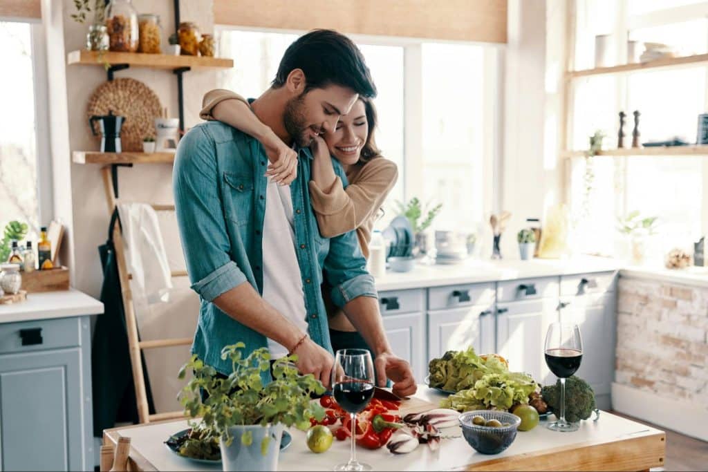 A man and woman at the kitchen