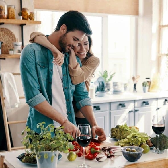 A man and woman at the kitchen