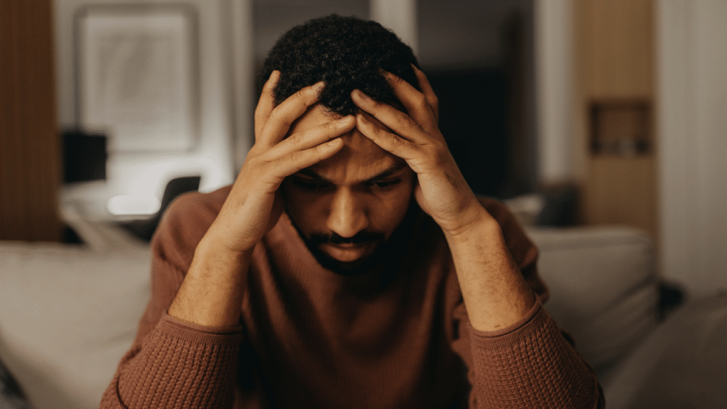 A man looking anxious at home