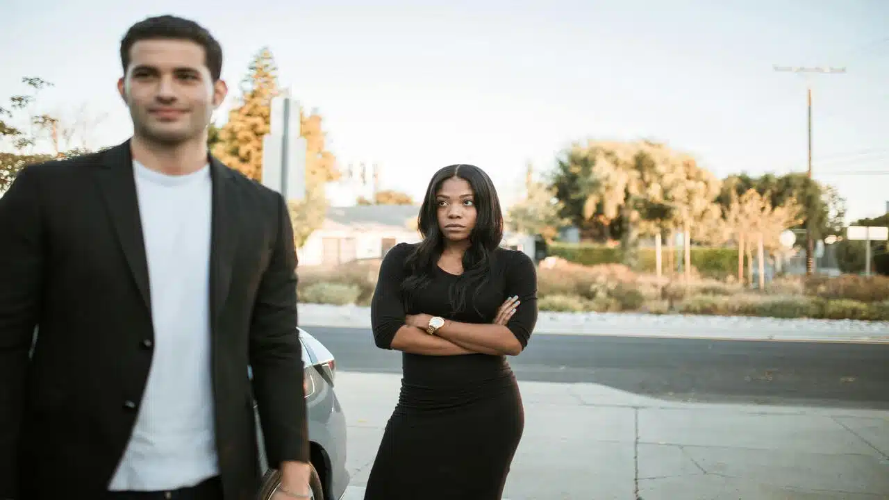 A woman looking upset at her husband