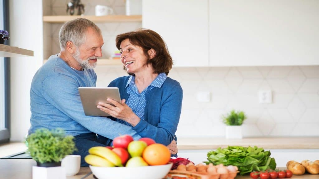 A couple having a conversation in the kitchen