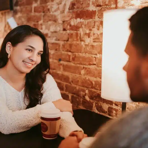 A woman smiling at her date