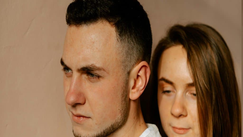 A man and a woman standing next to each other.