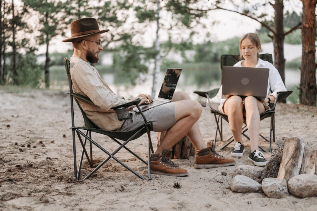 A Couple Having Conversation while Working at the Campsite