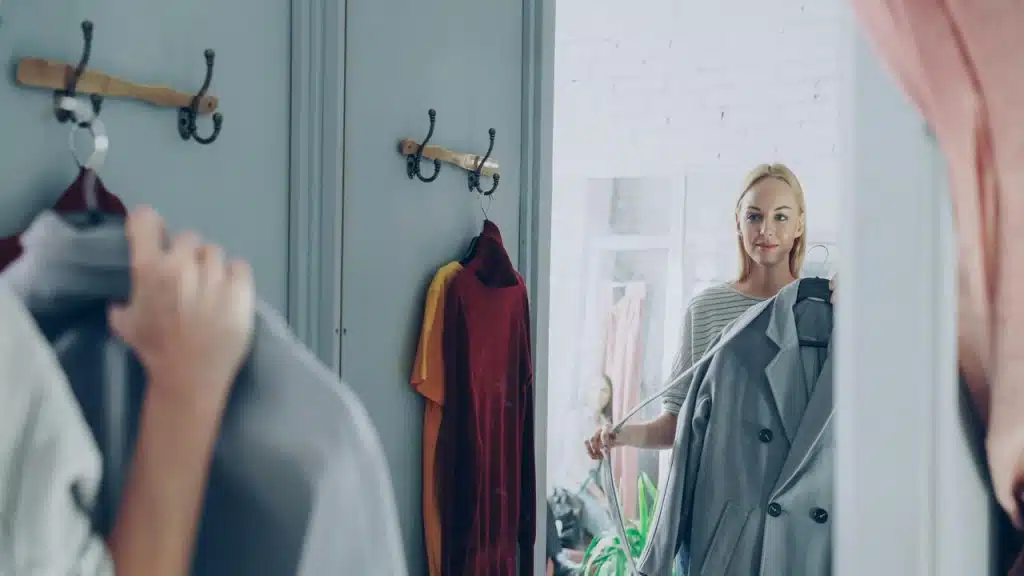 A woman trying on clothes at the store