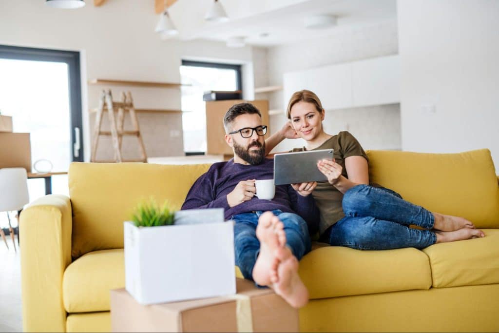 A man and woman at the sofa