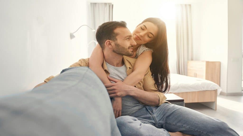 A couple being affectionate at home