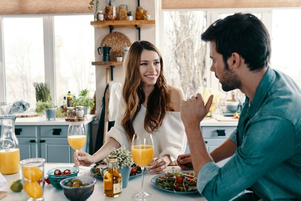A couple enjoying a healthy breakfast at home.