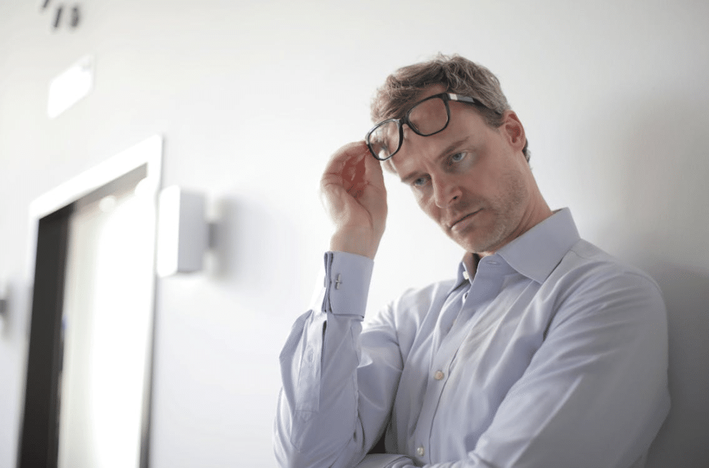 A man leaning on a wall