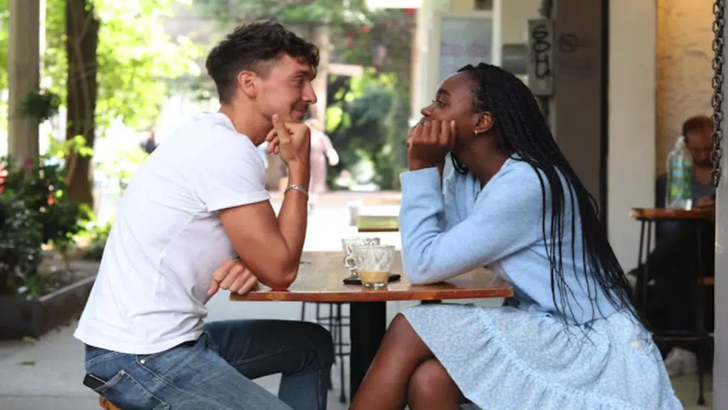 A couple looking at each other during their date