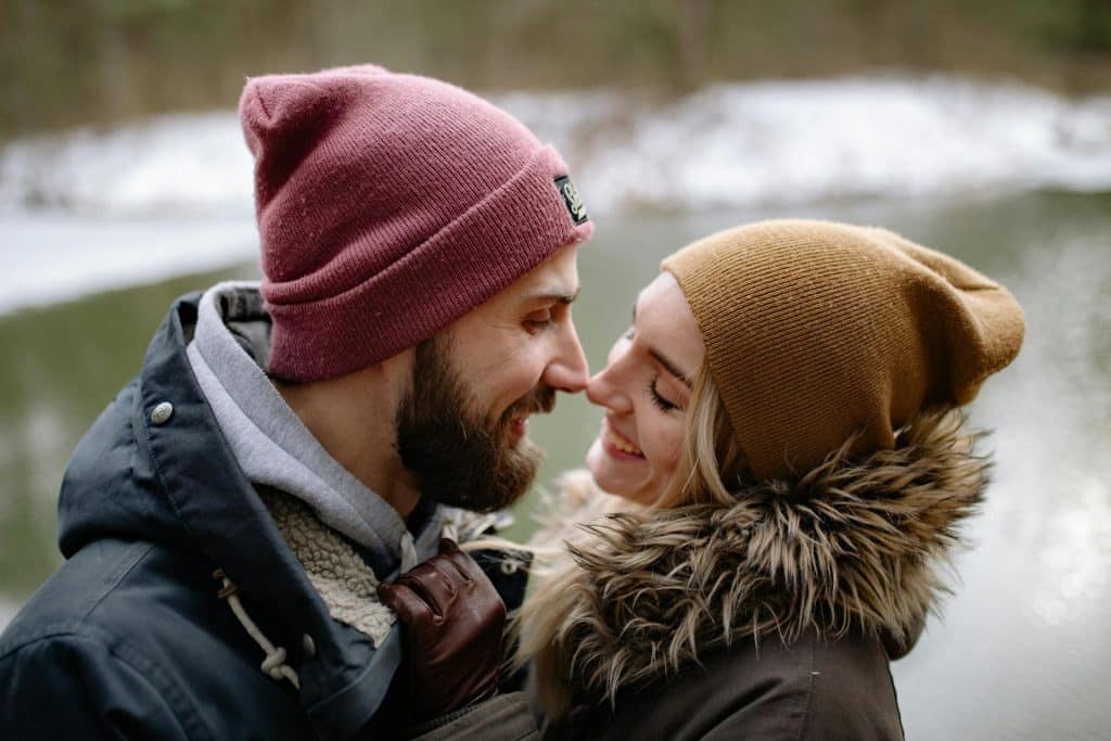 The couple is lovingly looking at each other.