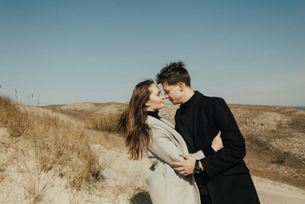 The couple is looking at each other.