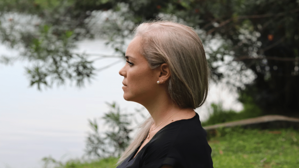 A woman looking sad outdoors