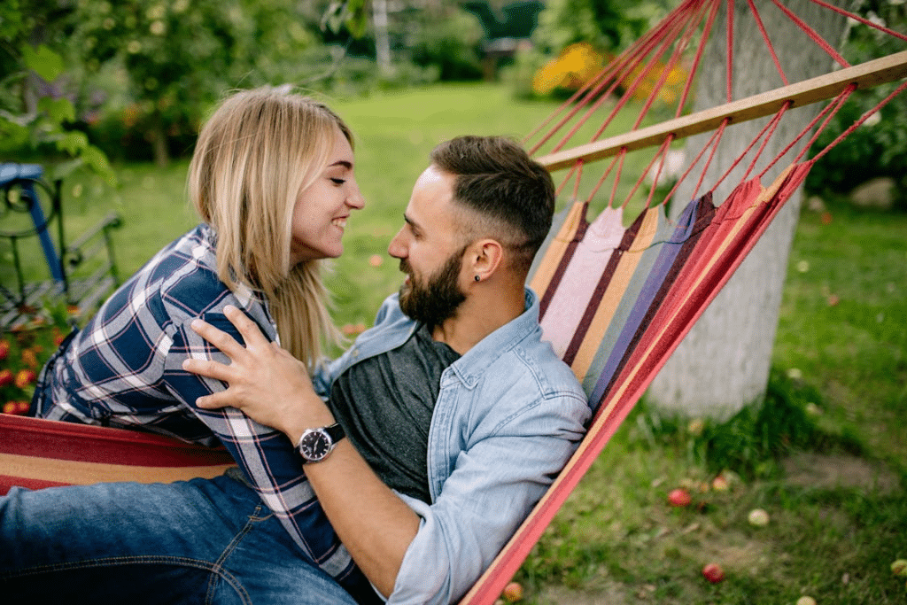 A Woman Hugging a Man on a Hammock