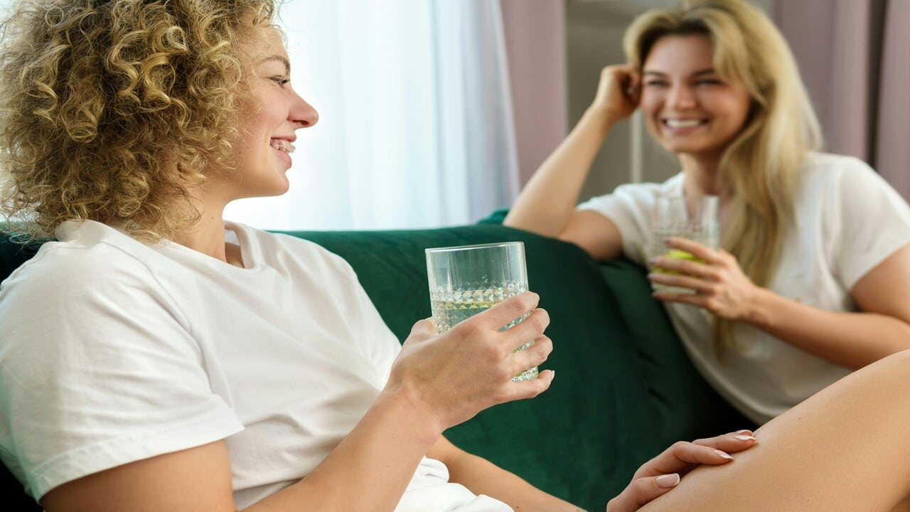 Female friends smiling while talking 