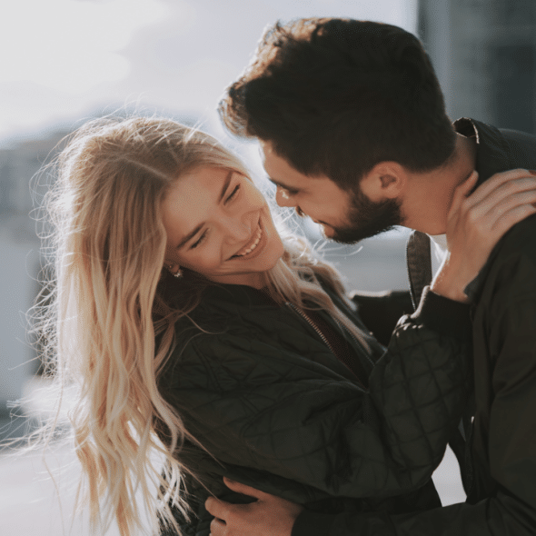 A couple about to kiss in public