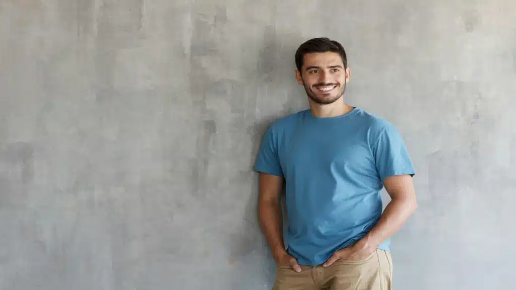 A man smiling while at work