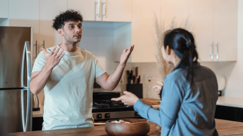 A couple fighting in the kitchen