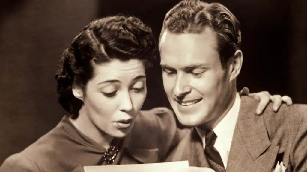 A man and a woman looking at a check.