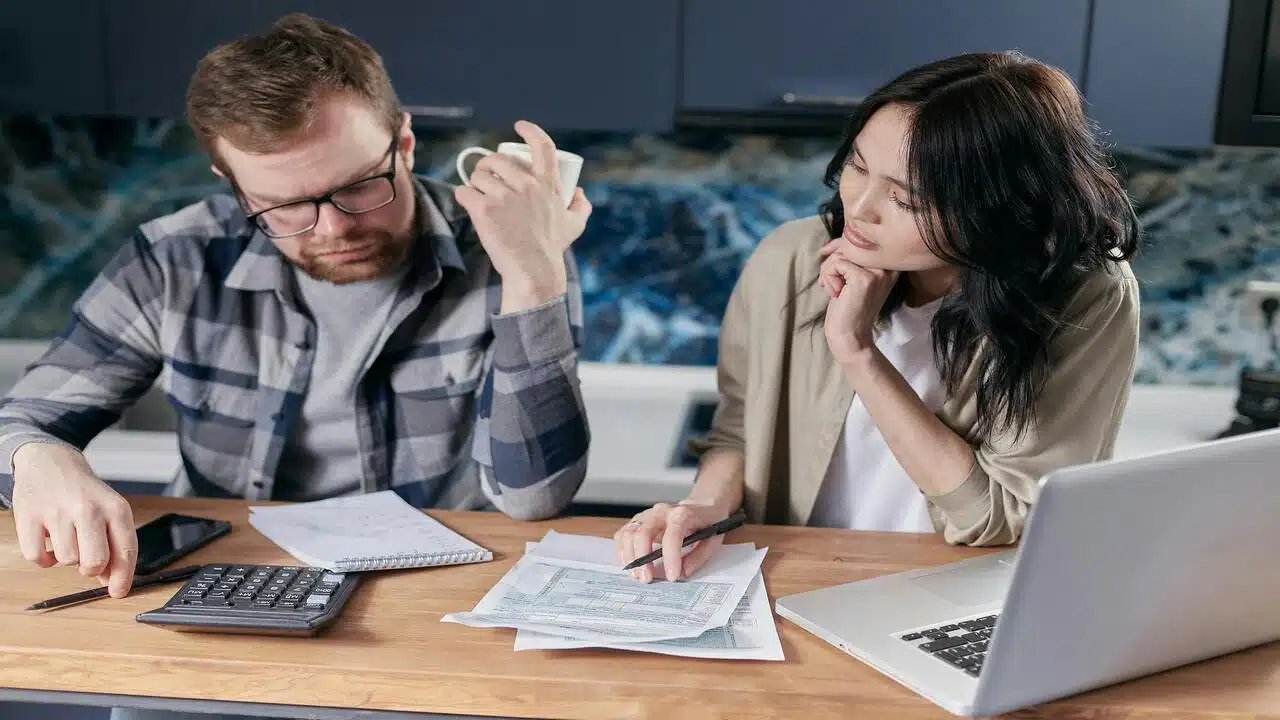 A couple working on their bills together 
