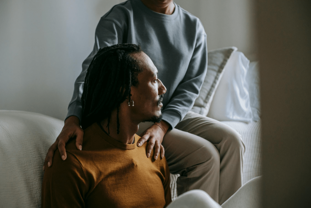 African American couple resting in bedroom together