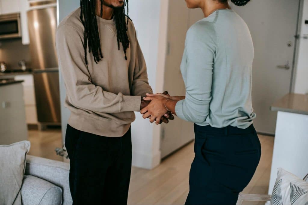 A man and woman shaking hands