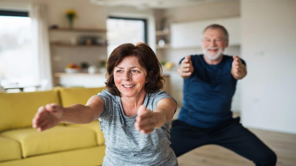 A couple doing exercises at home together