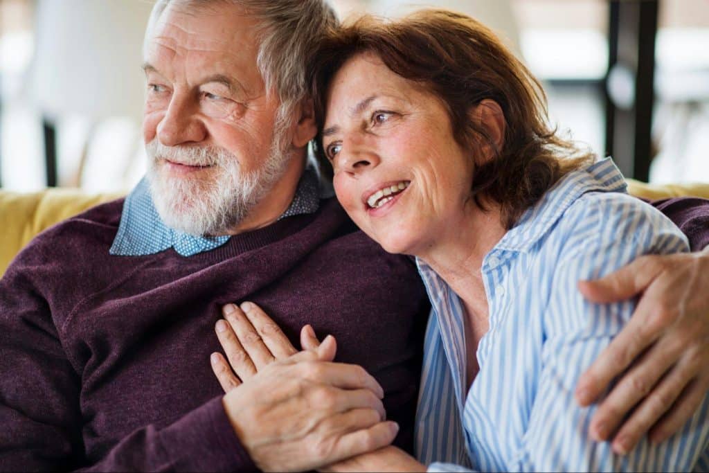 A man hugging a woman