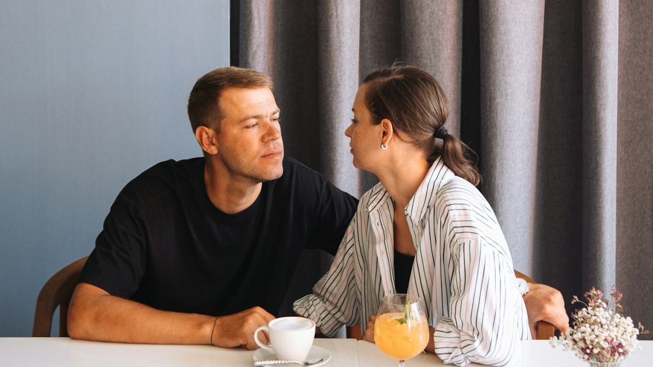 A man and a woman sitting at a table.