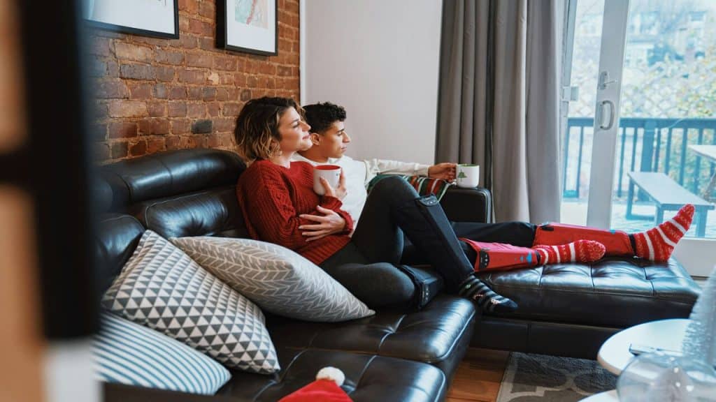 A couple relaxing on the couch