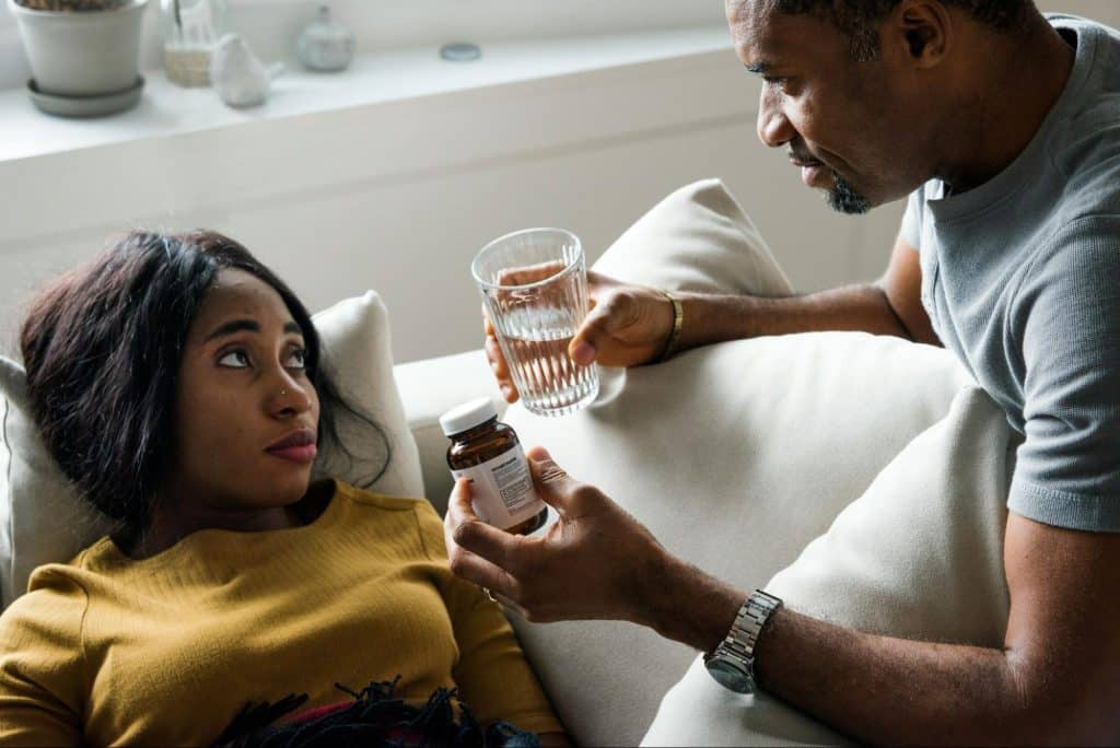 A husband taking care of his wife
