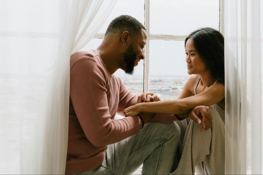 A man and woman facing each other