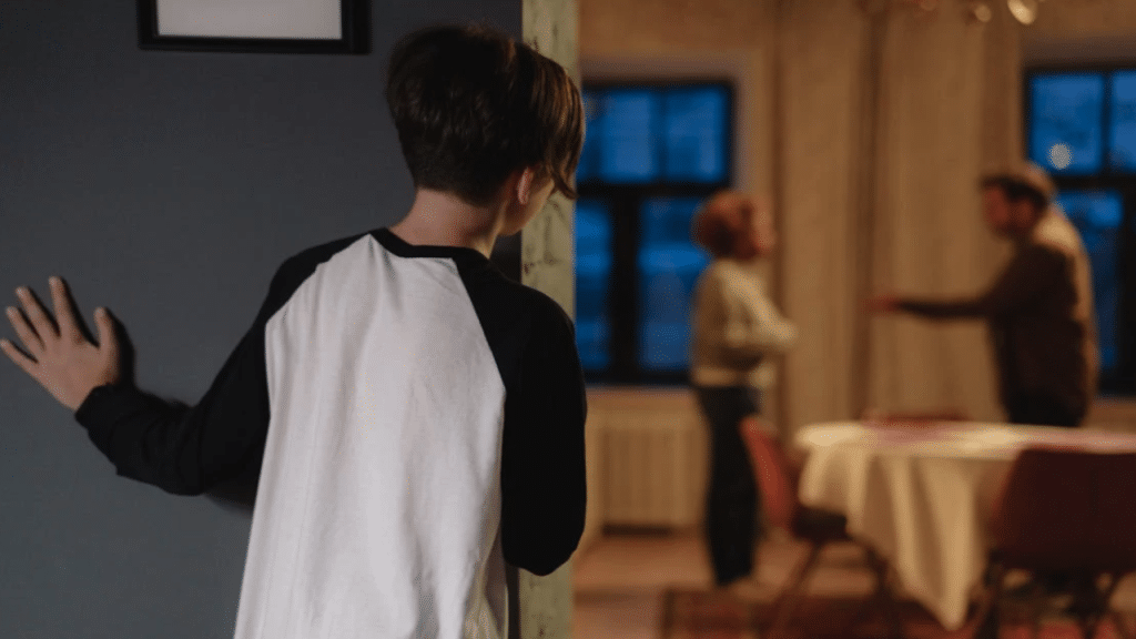 A child watching his parents fight