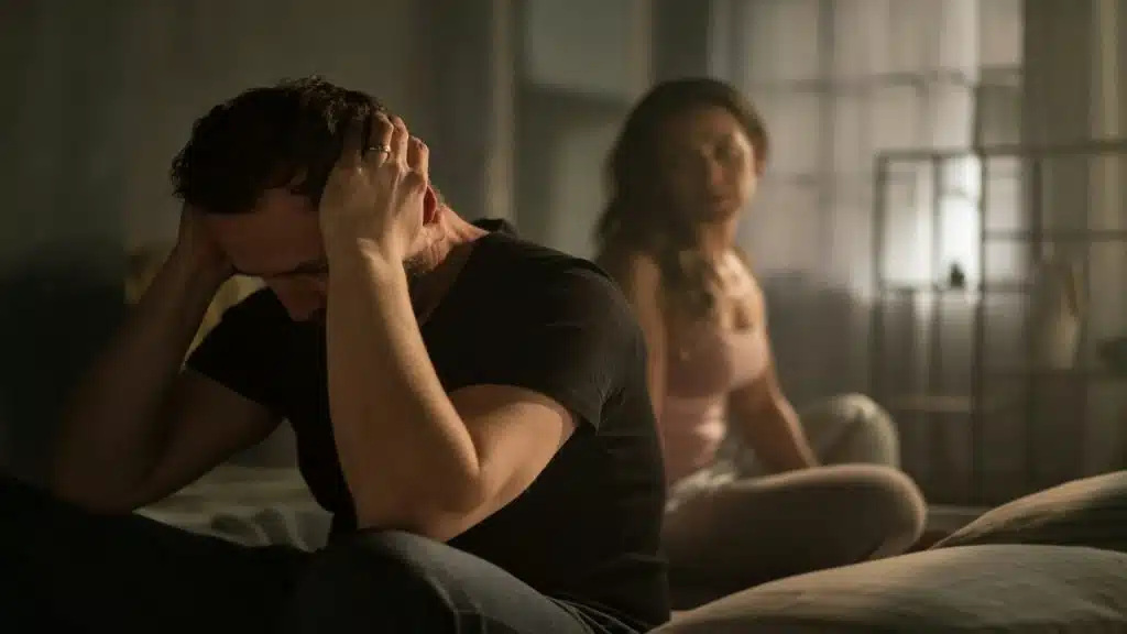A couple arguing in bed